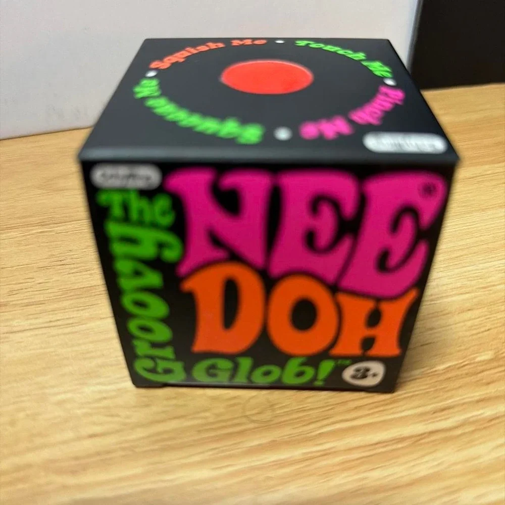 Authentic Schylling NeeDoh Groovy Glob Orange Squishy
